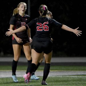 Fox Chapel’s Emily McKee (left) celebrates with Lily McLaughlin after scoring against Plum during their WPIAL Class 3A semifinal Monday.
