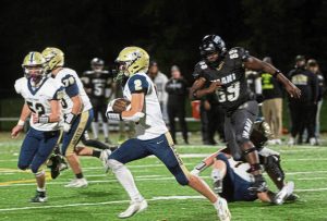 Freeport’s Bryson Paga (2) runs against Imani Christian on Friday, Oct. 24, 2025, at UPMC Graham Field in Wilkinsburg.