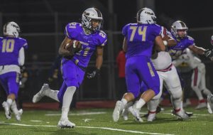 <span data-olk-copy-source="MessageBody">Plum’s Eryck Moore looks for yardage behind a block from Colton Lowman (74) on Oct. 30, 2020 as the Mustangs defeated McKeesport, 12-9, in an opening round Class 4A playoff game.</span>