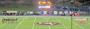 Quaker Valley (left) and Mt. Pleasant girls soccer players line up for the national anthem Thursday night before their WPIAL 2A third-place game at Chuck Knox Stadium.