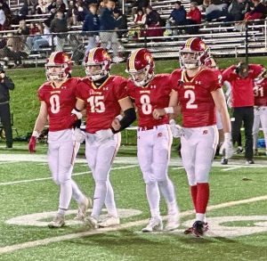 North Catholic captains head to midfield for the coin toss ahead of a WPIAL Class 3A playoff game against Burrell on Oct. 31, 2025, at J.C. Stone Field.