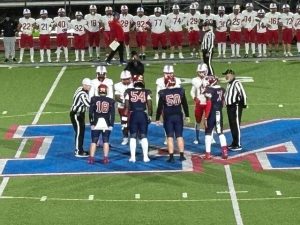 Players from Chartiers Valley and McKeesport head to midfield for the coin toss before their WPIAL playoff game Oct. 31, 2025, at McKeesport.