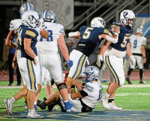 Norwin's Lucas Altier (57) and Josh Lenart (5) react following a sack against Hempfield on Friday, Oct. 3, 2025, at Norwin.