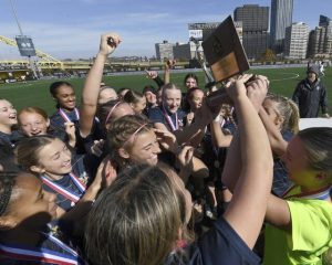 The Freeport girls soccer team celebrates with the WPIAL championship trophy after defeating Burrell, 1-0, in the Class 2A final on Saturday, Nov. 1, 2025, at Highmark Stadium.