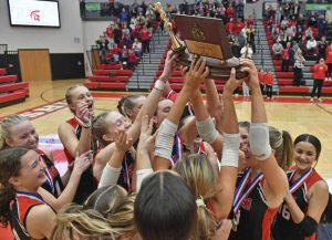 Eden Christian Academy celebrates with the trophy after beating Serra Catholic in the WPIAL Class A girls volleyball championship Saturday, Nov. 1, 2025, at Peters Township High School.