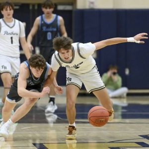 Franklin Regional’s Colin Holt battles Seneca Valley’s Andrew Omasits for a loose ball Dec. 2, 2024, in Murrysville.