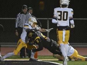 Thomas Jefferson’s Kane Eggerton powers into the end zone against Mars’ Ayden Yocum and Brody Spencer during first-round WPIAL Class 4A playoff action Friday, Oct. 31, 2025 at Thomas Jefferson Stadium.
