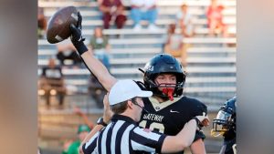 Gateway’s Jakson Smith holds the ball up to show he recovered the game’s opening kickoff against Kiski Area on Sept. 12 at Antimarino Stadium.