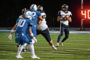 Apollo-Ridge’s Alex Clawson gets protection while looking to pass against South Park last month.