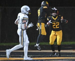 North Allegheny’s Gavin Ust celebrates with Luke Rohan after Rohan’s fourth-quarter touchdown against Norwin during the WPIAL Class 6A semifinals Friday.