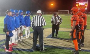 Jeannette (left) and Clairton meet for the coin toss Friday, Nov. 7, 2025, before their WPIAL Class A quarterfinal game.