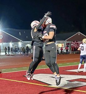 Avonworth's Dimitri Velisaris (left) celebrates with Bryce Metz during their WPIAL Class 3A quarterfinal game against Freeport on Nov. 7, 2025, at Avonworth.