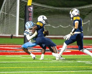 Washington’s Ameer Nelsen brings down South Allegheny’s Derrick Pace during their WPIAL Class 2A quarterfinal game Friday.