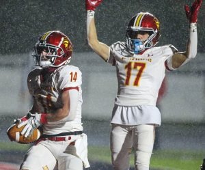 North Catholic's Ryker Kennedy scores as Preston Simko signals the touchdown in a WPIAL Class 3A quarterfinal against Elizabeth Forward on Friday, Nov. 7, 2025.