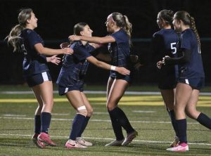 Freeport’s Lucy Hassler hugs Camryn Woods after Woods’ first goal against Fort LeBoeuf during a PIAA first-round game Tuesday.