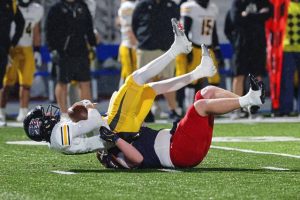 McKeesport’s Matthew Sebelia sacks Thomas Jefferson quarterback Harrison Kolling in the WPIAL Class 4A semifinals Friday.