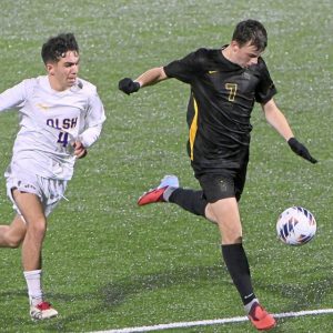 Bentworth’s Adam Moessner drives past OLSH’s Andre Kolocouris to score during the WPIAL Class A championship game Oct. 30 at Highmark Stadium.
