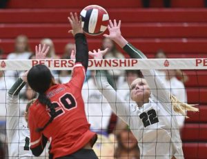 Pine-Richland’s Piper Vogel defends on Peters Township’s Angelina Williams during the WPIAL Class 4A volleyball championship match Nov. 1.