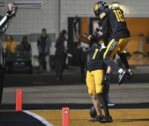 North Allegheny’s Gavin Ust celebrates with Cameron Kushner after Kushner’s touchdown against Norwin during the WPIAL Class 6A semifinals Friday.