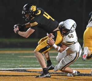 Norwin’s Mason Kugler sacks North Allegheny’s Brady Brinkley during the WPIAL Class 6A semifinals last week.