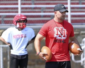 North Hills interim head coach Brody Zangaro works with his team during a preseason practice.