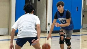 Leechburg senior forward Gabe Santiago, being guarded by sophomore Dylan Whitlinger, is among the returning players for the 2025 Blue Devils.