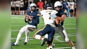 Norwin quarterback Tristyn Tavares looks to throw a touchdown pass to Zack Pawling against Mt. Lebanon on Oct. 24.