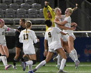 North Allegheny’s Kieran Shannon celebrates with Ava Hutter after scoring against Seneca Valley during the WPIAL Class 4A championship game Oct. 31 at Highmark Stadium.