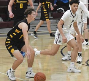 Riverview guard Rex Roberts dribbles against Greensburg Central Catholic guard A.J Tarpley on Jan. 7, 2025.