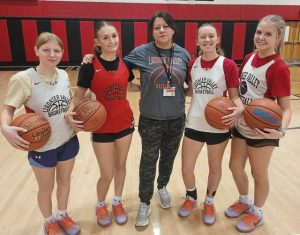 Ligonier Valley returning letter winners, from left, Isabella Constable, Bella Dolton, Allegheny Myers and Ruby Smith pose with coach Christy Hajjar. Abby and Gabby Springer are also returning letter winners.