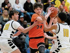 Springdale’s Liam Dexter drives through Riverview defenders Jan. 3, 2024.