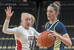 For Chapel’s Lyla Jablon (left) defends Kiski Area’s Gianna DeVito during the Holiday Hoops Classic at PPG Paints Arena last season.
