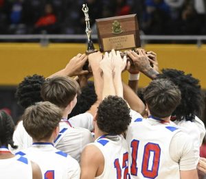 Jeannette celebrates with the trophy after beating Union in the WPIAL Class 2A championship game Feb. 28 at Petersen Events Center.