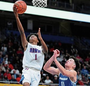 Jeannette’s Kymon’e Brown scores past Union’s Jordyn Kelley during the WPIAL Class 2A championship game Feb. 28 at Petersen Events Center.