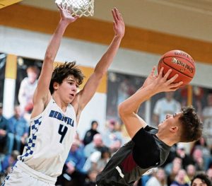 Hempfield’s Danny Husenits defends on Greensburg Central Catholic’s David Wachinski during the Greensburg Salem Holiday Classic last season.