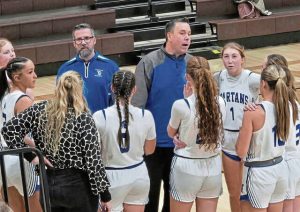 Hempfield girls basketball coach Bob Madison talks to his team last season.