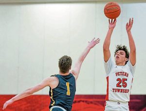 Peters Township’s Dylan Donovan attempts a 3-pointer over Mars’ Austin Campbell during the WPIAL Class 5A semifinals Feb. 25.