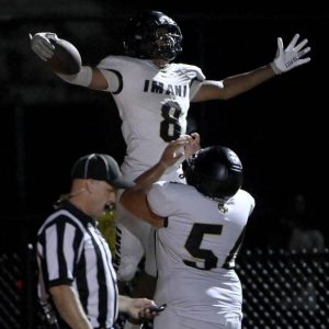 Imani Christian’s Dajuan Craighead (8) celebrates his fourth-quarter touchdown with Quinton Morris against Clairton on Aug. 22.
