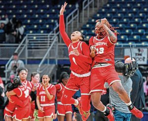 Aliquippa’s Clara Brown (left) and Denim Odom (right) celebrate as time expires on the Quips’ victory over Neshannock during the WPIAL Class 2A championship game March 1 at Petersen Events Center.