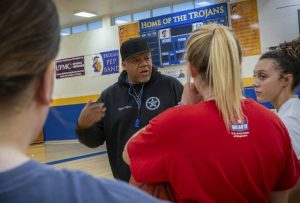 Derry coach Ron Moore speaks to the girls basketball team during practice Tuesday.