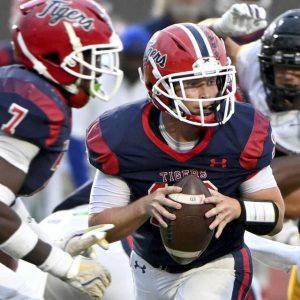 McKeesport quarterback Matthew Miller takes a snap against Thomas Jefferson during their game on Friday, Sept. 5, 2025, at McKeesport.