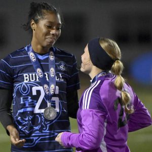 Burrell’s Makiah Buchak hugs goalkeeper Leah Waldsmith after receiving their silver medals following the PIAA Class 2A state championship game against Archbishop Wood on Friday, Nov. 14, 2025, at Northeastern York High School.