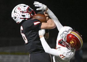 Avonworth’s Jaden Jones pulls in a touchdown pass over North Catholic’s Peyton Book during the WPIAL Class 3A semifinals Friday, Nov. 14, 2025 at North Allegheny High School.