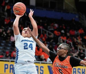 Union’s Miera Gunn scores over Clairton’s Jamiya “JuJu” Childs during the WPIAL Class A championship game Feb. 28 at Petersen Events Center.