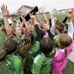 The South Fayette girls soccer team celebrates with the state championship trophy after defeating Radnor, 3-1, in the PIAA Class 3A final on Saturday, Nov. 15, 2025, at Northeastern York High School.