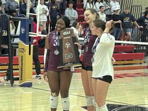 Oakland Catholic's captains accept the runner-up trophy after losing to Pope John Paul II in the PIAA Class 3A championship game Saturday, Nov. 15, 2025.