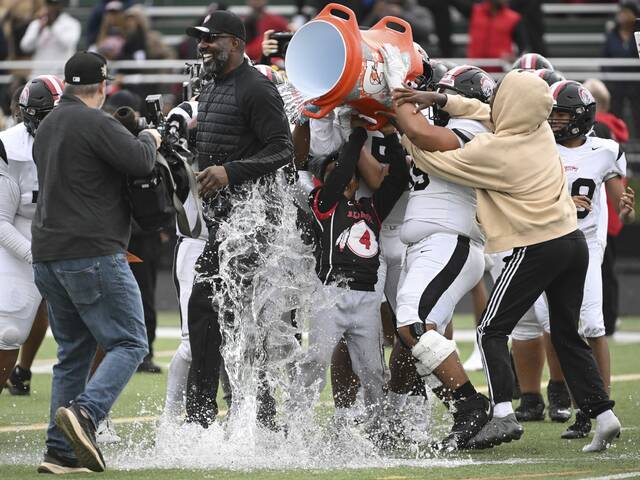 Aliquippa head coach Mike Warfield gets soaked with water after beating McKeesport in the WPIAL Class 4A football championship Saturday Nov. 15, 2025 at Pine-Richland.