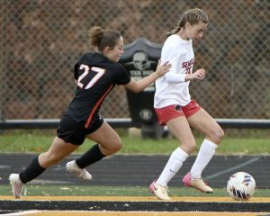 Springdale’s Mia Pesce battles Sewickley Academy’s Sarah Merryman for possession during their PIAA Class A state quarterfinal on Saturday, Nov. 8, 2025, at North Allegheny.