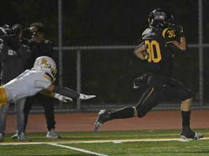 Thomas Jefferson’s Tyler Eber leaves Mars’ Ayden Yocum behind on the way to a touchdown during first-round WPIAL Class 4A playoff action Oct. 31.