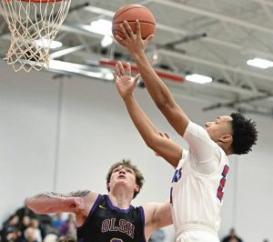 Jeannette’s Noah Sunder scores past OLSH’s Vann Kavals during a WPIAL Class 2A quarterfinal last season.